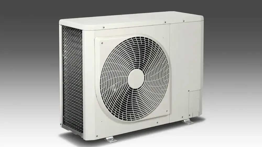 Outdoor air conditioner condenser unit beside a home